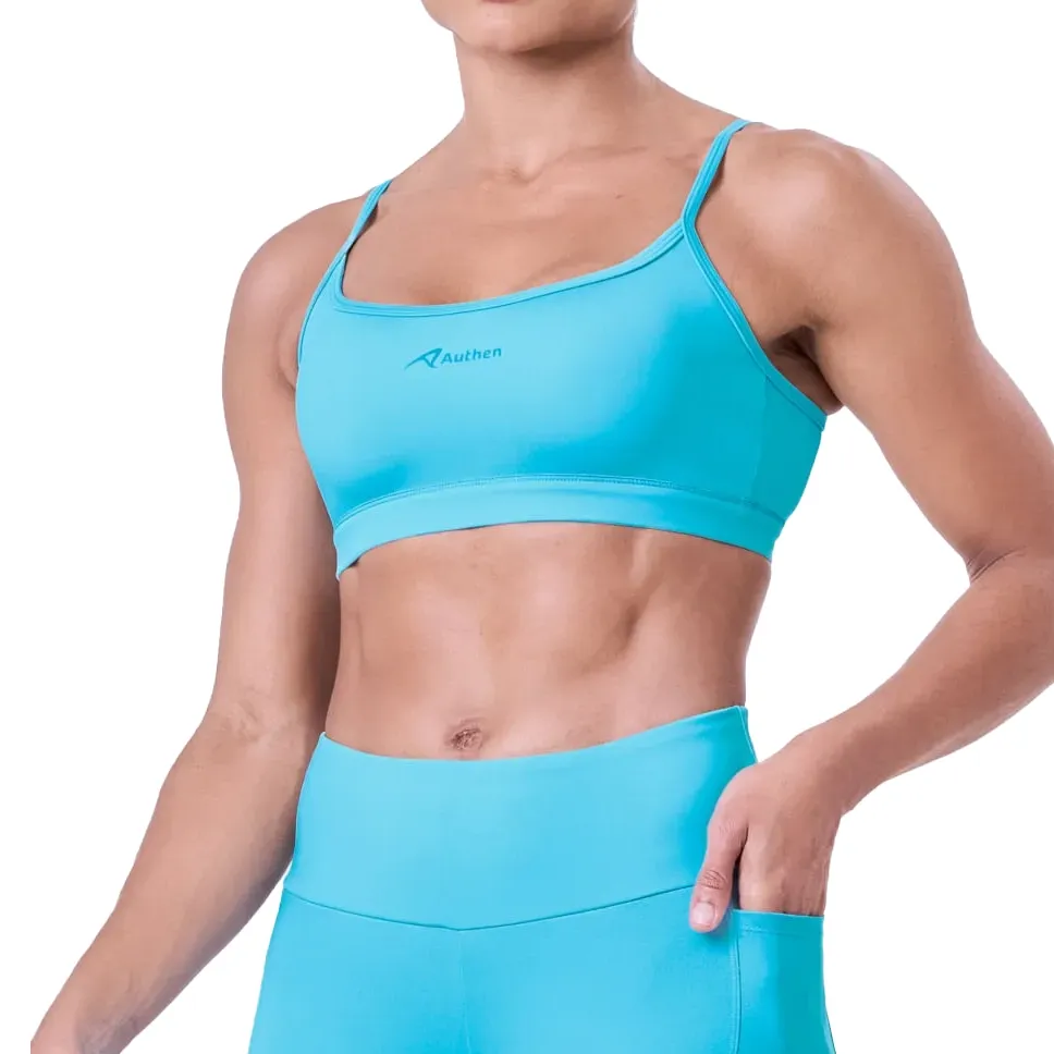 Top esportivo ajustável feminino Authen azul claro vista frontal com design minimalista
